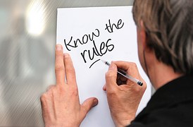 man writing rules