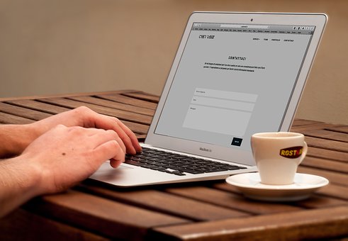 typing on laptop